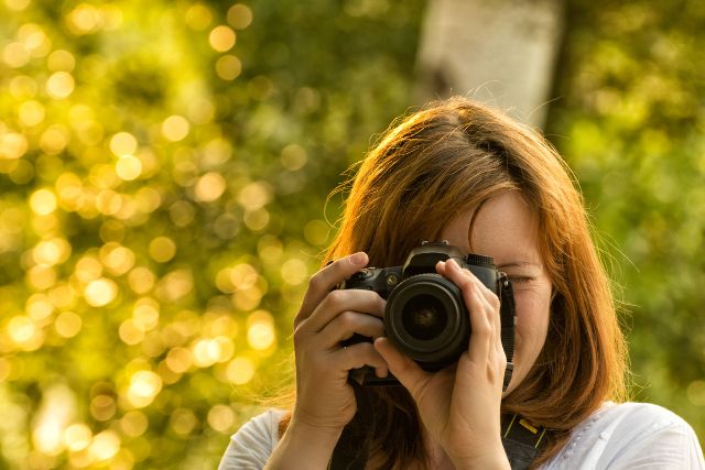 A professional photographer taking pictures.